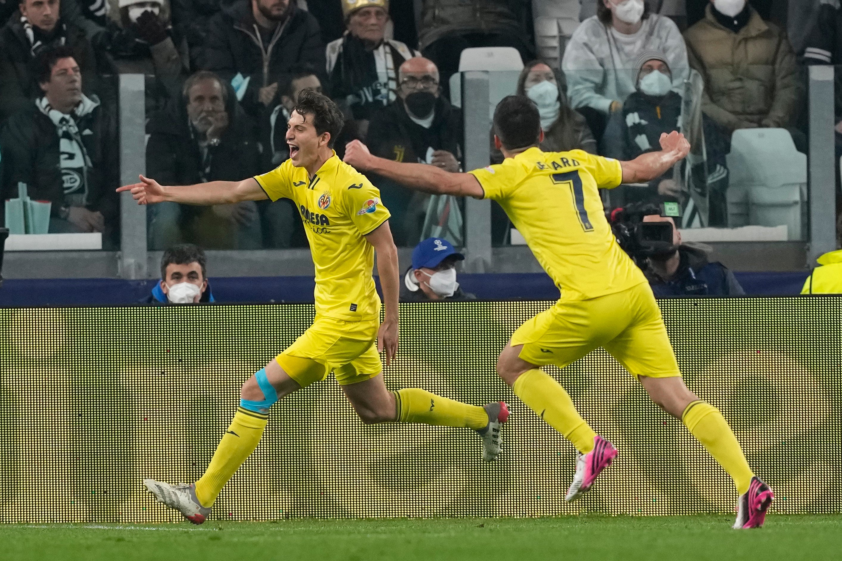 Pau Torres, left, celebrates scoring Villarreal’s second goal in their 3-0 win at Juventus (Antonio Calanni/AP)