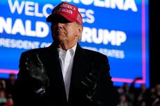 Trump supporters conducted armed door to door visits to ‘intimidate’ voters, lawsuit claims