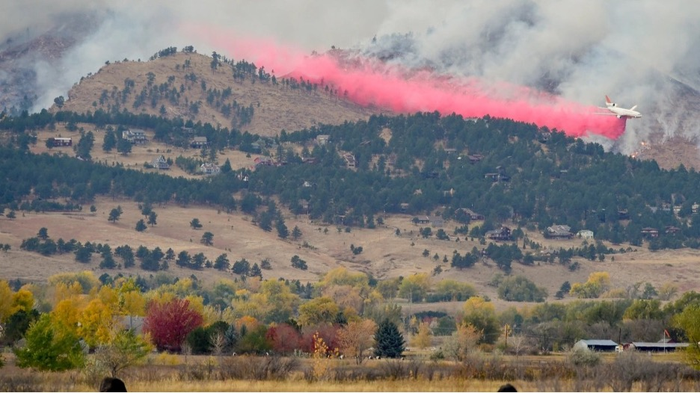 A DC-10 drops fire retardant on the edge of the 2020 Calwood Fire in Colorado