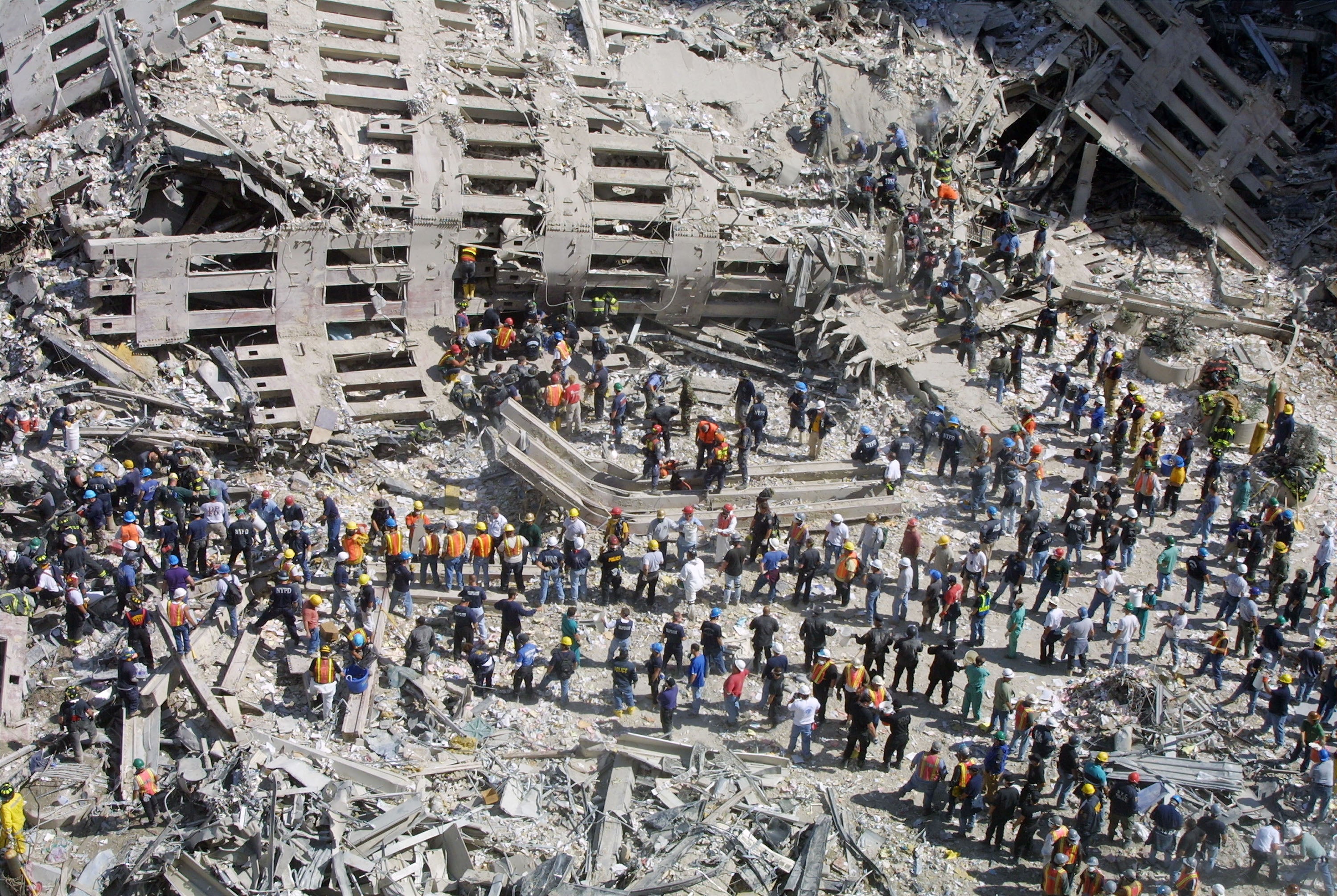 Rescue workers sift through the wreckage of the World Trade Centre two days after the attack