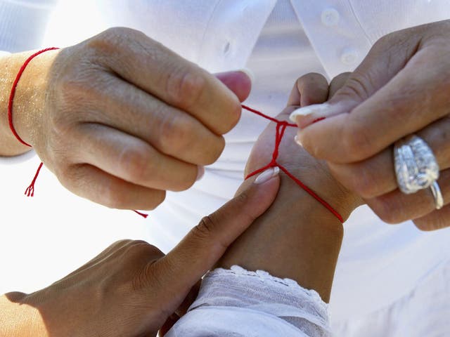 <p>The red string is a hallmark of the Kabbalah school of thought </p>