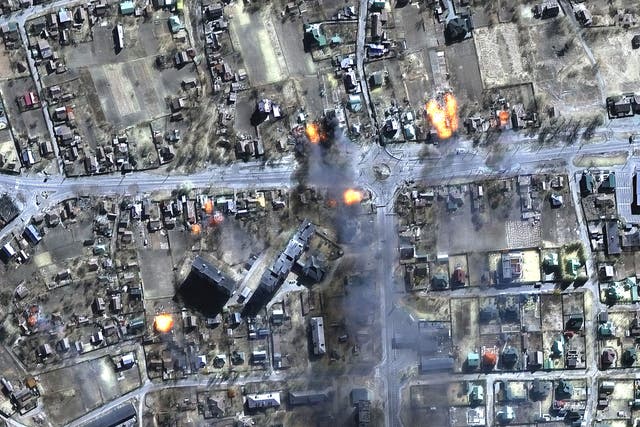 Satellite imagery showing flames pouring from buildings in a residential area of Chernihiv on Wednesday (Satellite image ©2022 Maxar Technologies/PA)