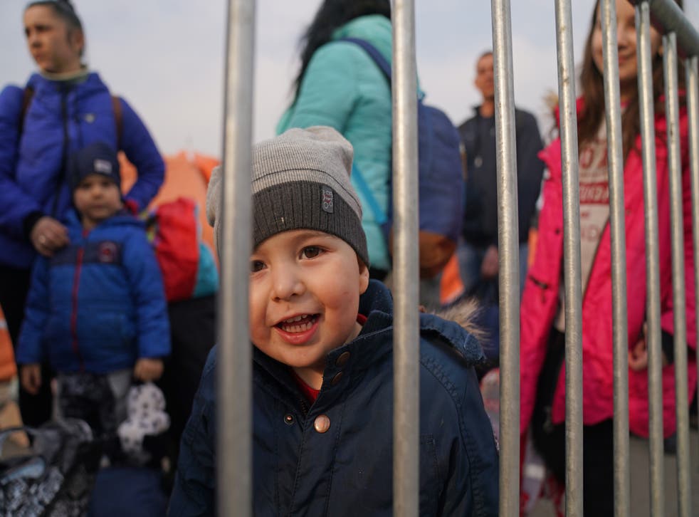 <p>People who have crossed the border point from Ukraine into Medyka, Poland, wait to board a bus (Victoria Jones/PA)</p>