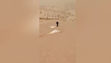 Dust from Sahara turns Sierra Nevada landscape orange as skiers take to slopes