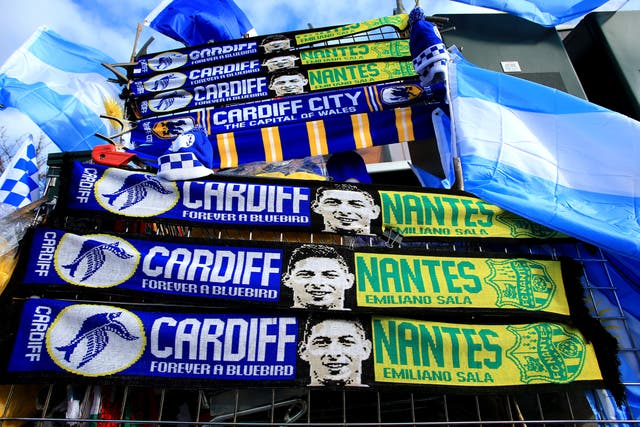 A view of half-and-half scarves placed outside Cardiff City Stadium in tribute to Emiliano Sala (Mark Kerton/PA)