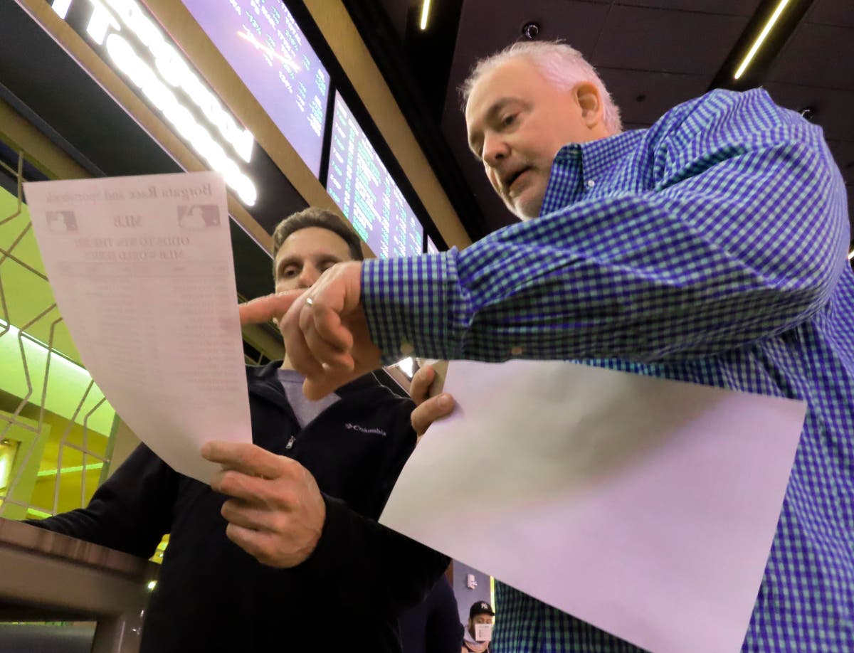 Method to their madness as fans bet on college hoops tourney Method to their madness as fans bet on college hoops tourney