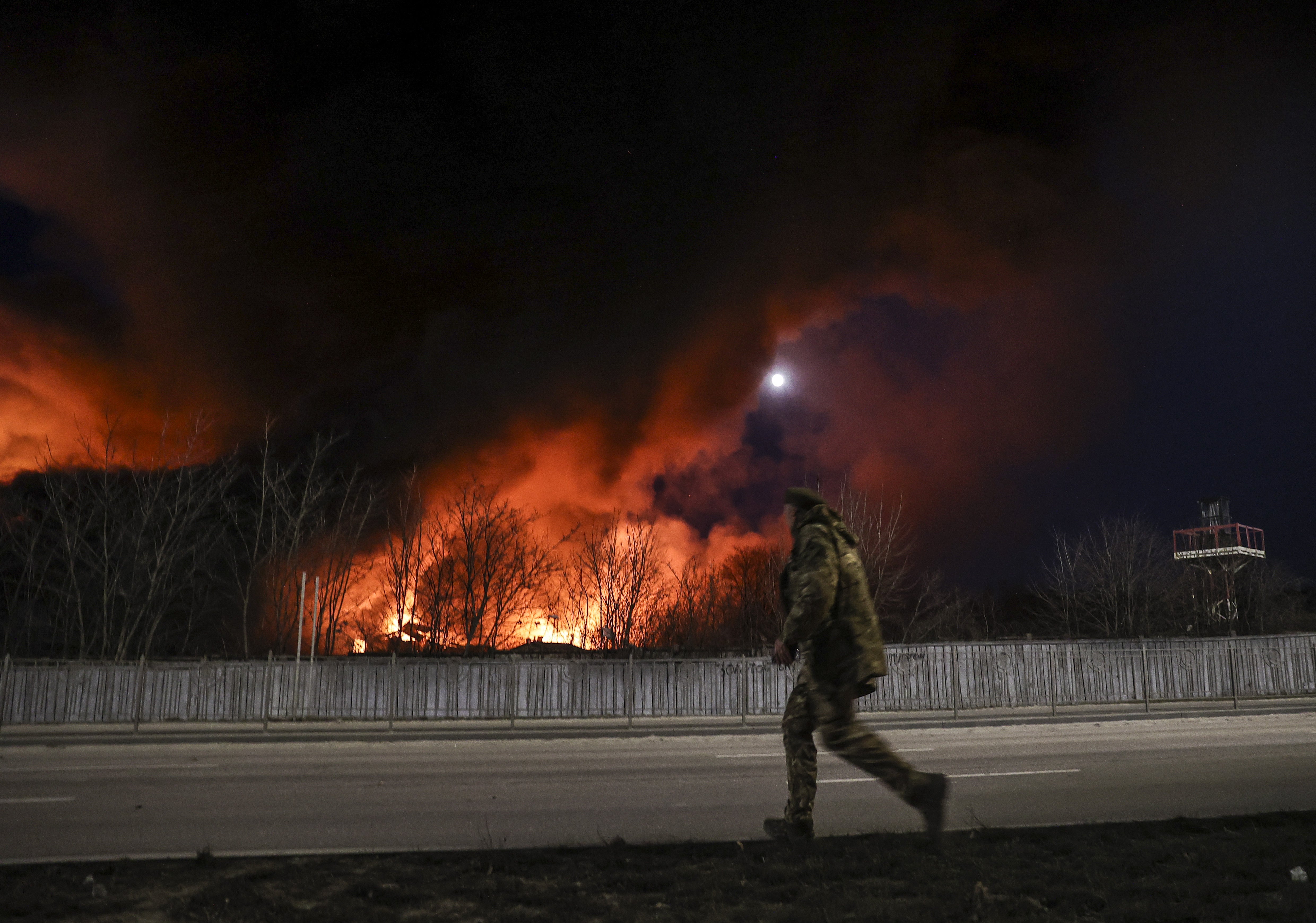 Smoke and flames rise due to a fire that broke out after Russian rockets hit warehouses in Sviatoshynskyi district, Kyiv