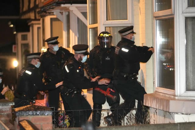 <p>Merseyside Police perform an early morning county lines raid last December</p>