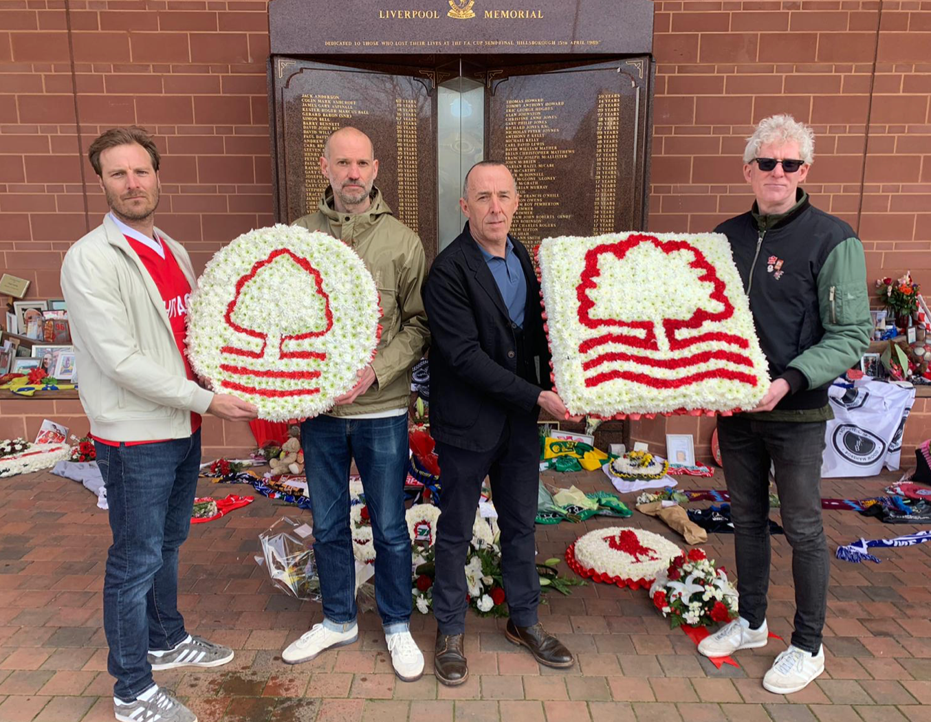 Members of the NFFC Supporters’ Trust share their support at the Hillsborough memorial