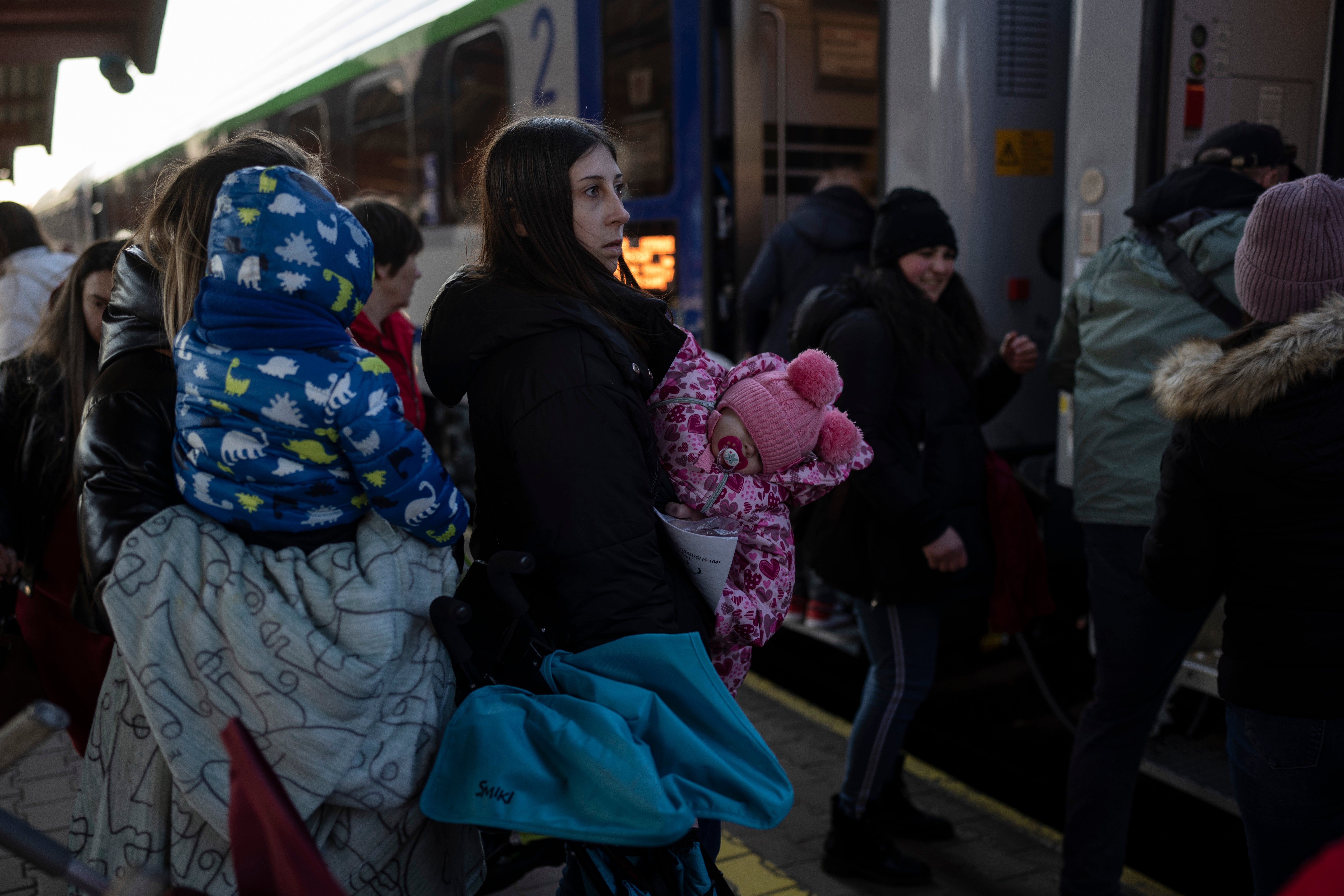 People who fled the war in Ukraine wait at the train station in Przemysl, southeastern Poland, 17 March 2022