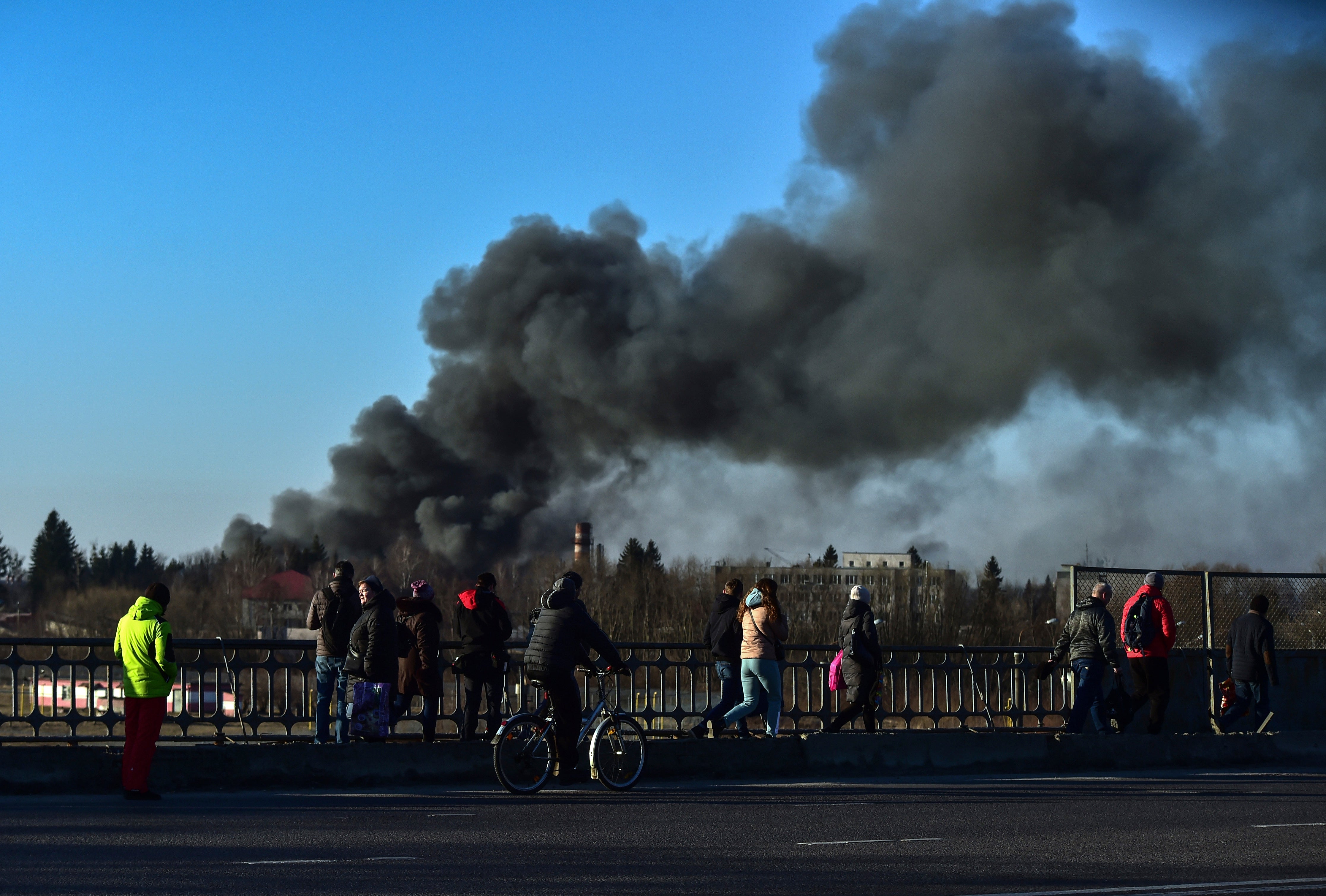 A cloud of smoke rises after an explosion near the airport, in Lviv, western Ukraine.
