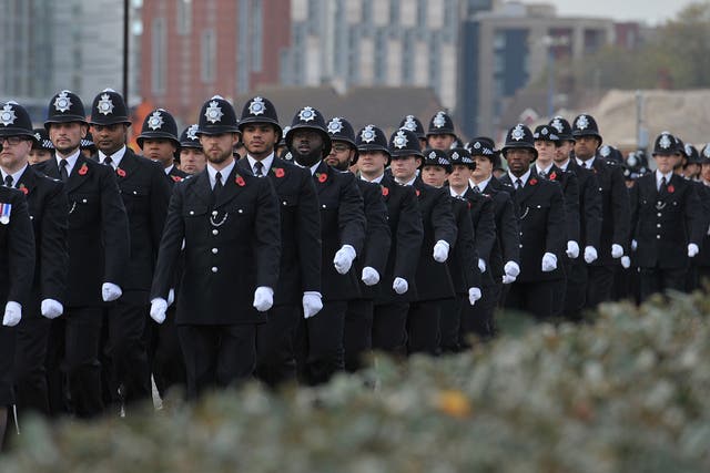 Metropolitan Police recruits marching during a Metropolitan Police passing out parade for new officers at Peel House in Hendon (Nick Ansell/PA)