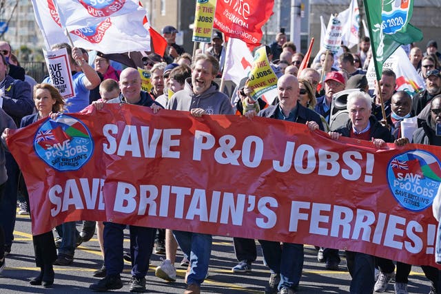 People protest on Snargate Street in Dover after P&O Ferries suspended sailings and handed 800 seafarers immediate severance notices (Gareth Fuller/PA)