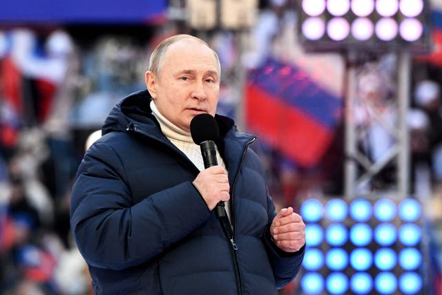 <p>Vladimir Putin gives a speech at the Luzhniki Stadium in Moscow on Friday </p>