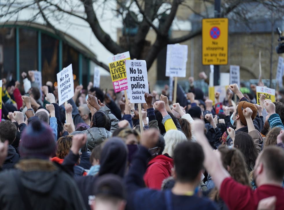 People demonstrate outside Stoke Newington Police Station in London over the treatment of a black 15-year-old schoolgirl who was strip-searched by police while on her period (PA)
