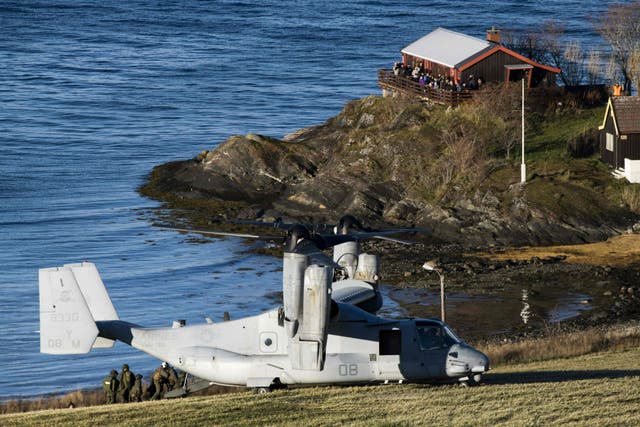 <p>A United States' V-22 Osprey, a multi-mission, tiltrotor military aircraft with both vertical takeoff and landing, lands to pick up Marines during a joint demonstration as part of the NATO Trident Juncture 2018 exercise in Byneset near Trondheim, Norway, October 30, 2018. </p>