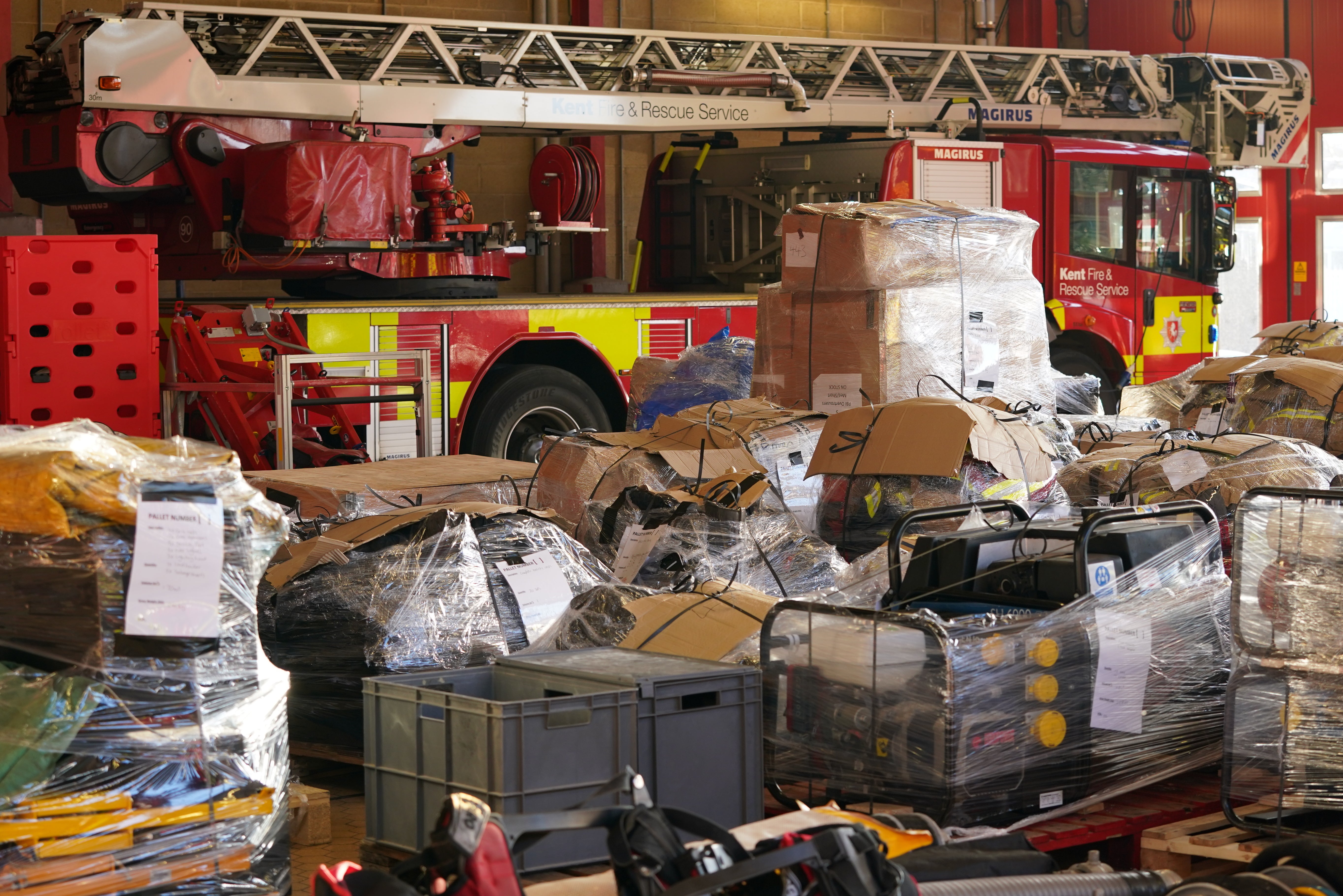Donated emergency service equipment was loaded at Ashford fire station (Gareth Fuller/PA)