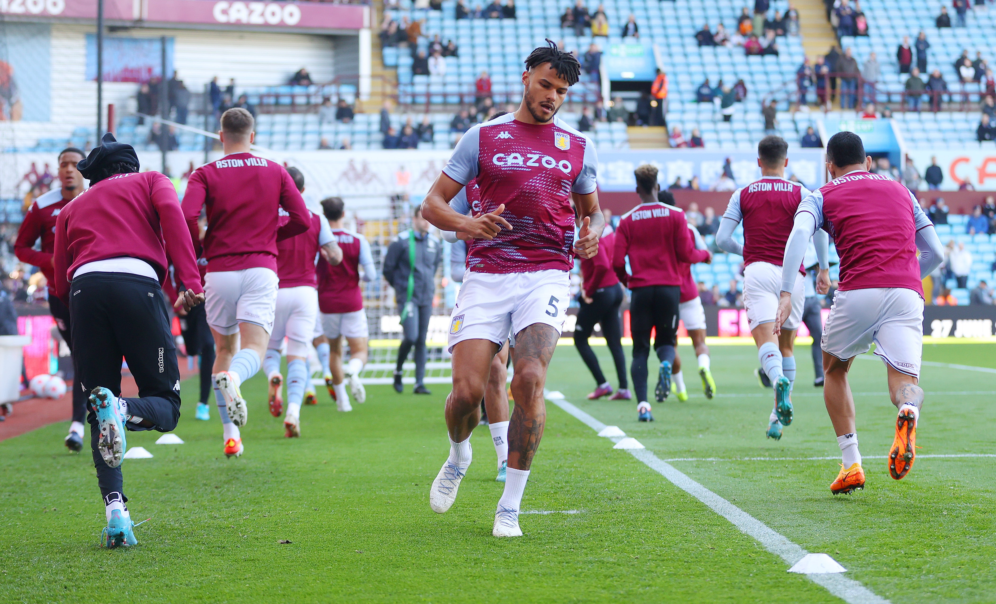 Aston Villa players warm up before kick-off