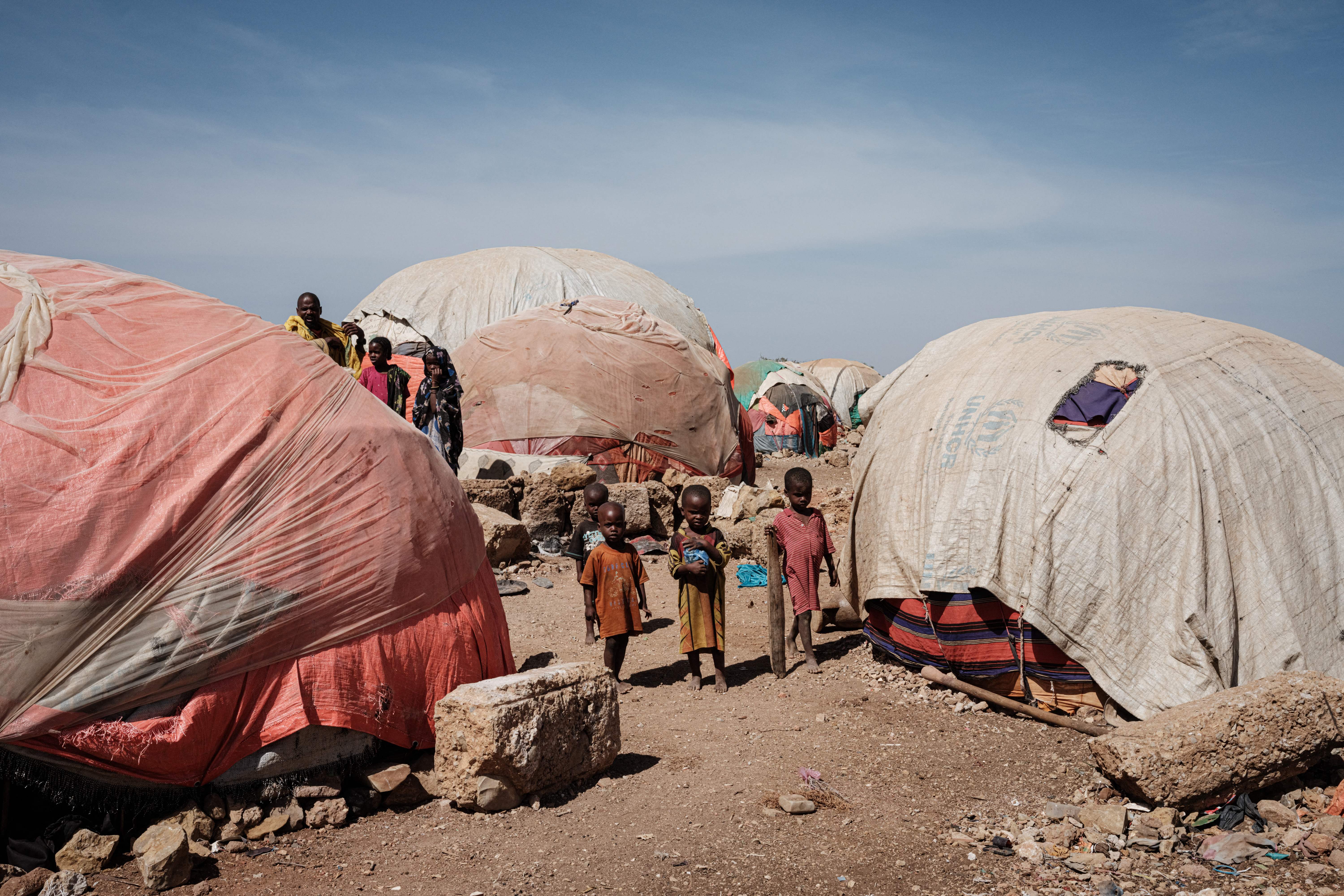 File photo: Children stand between makeshift tents woman at a camp for internally displaced persons (IDPs) in Baidoa, Somalia, 13 February 2022