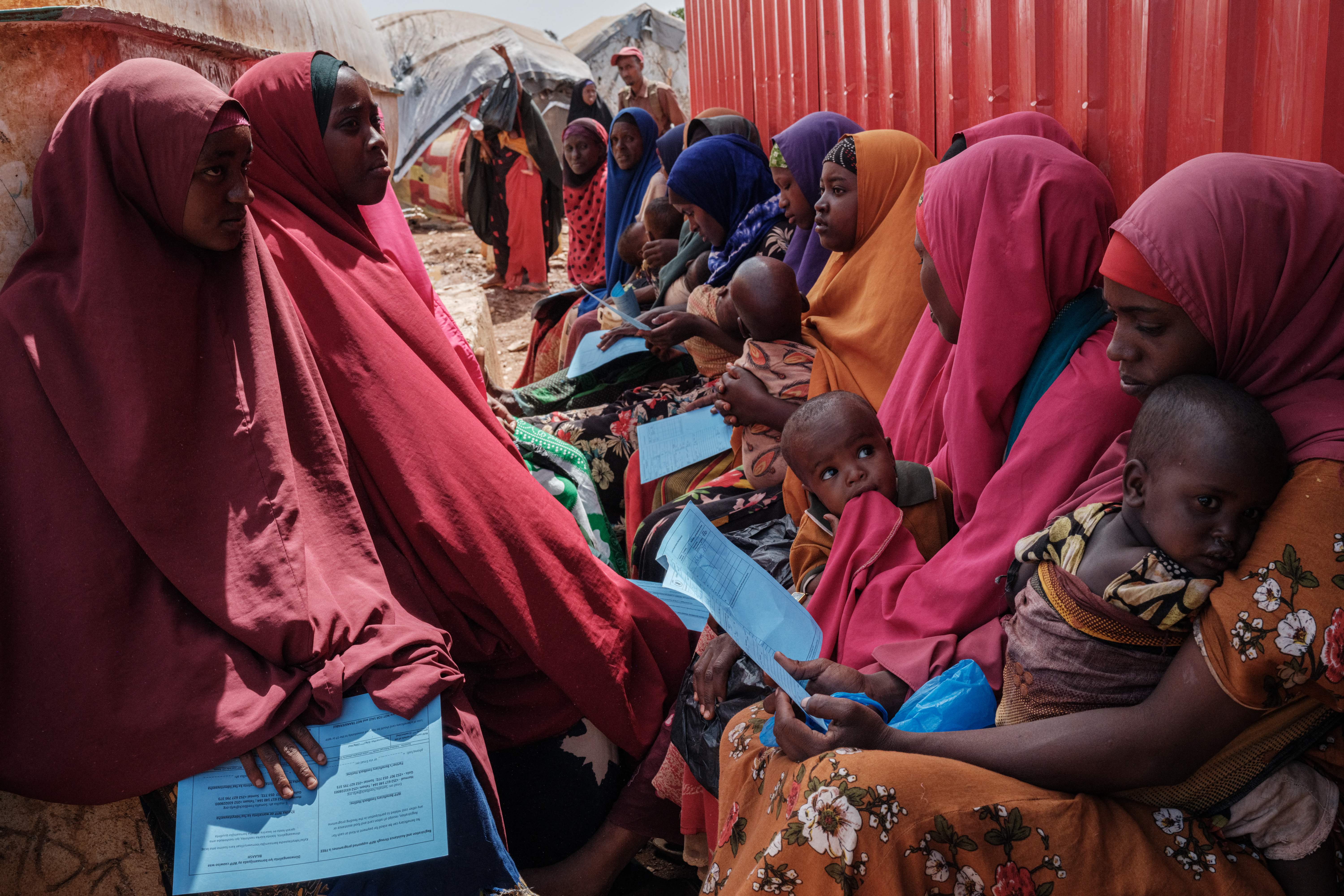 File photo: Mothers wait for high nutrition foods and health services at Tawkal 2 Dinsoor camp for internally displaced persons (IDPs) in Baidoa, Somalia, 14 February 2022