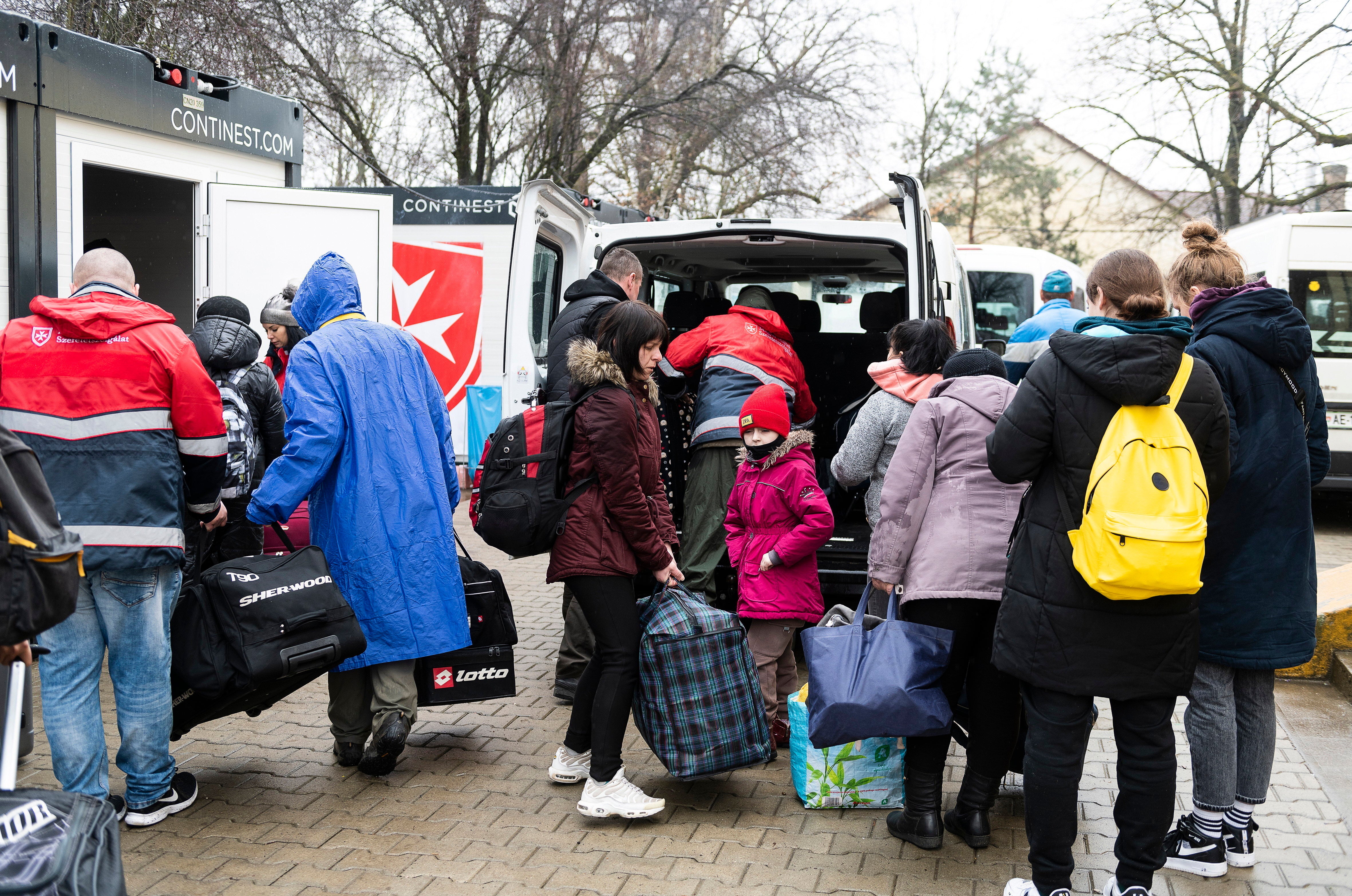 Refugees from Ukraine arrive at the help center of Beregsurany, near the Hungarian-Ukrainian border (Attila Balazs/AP)