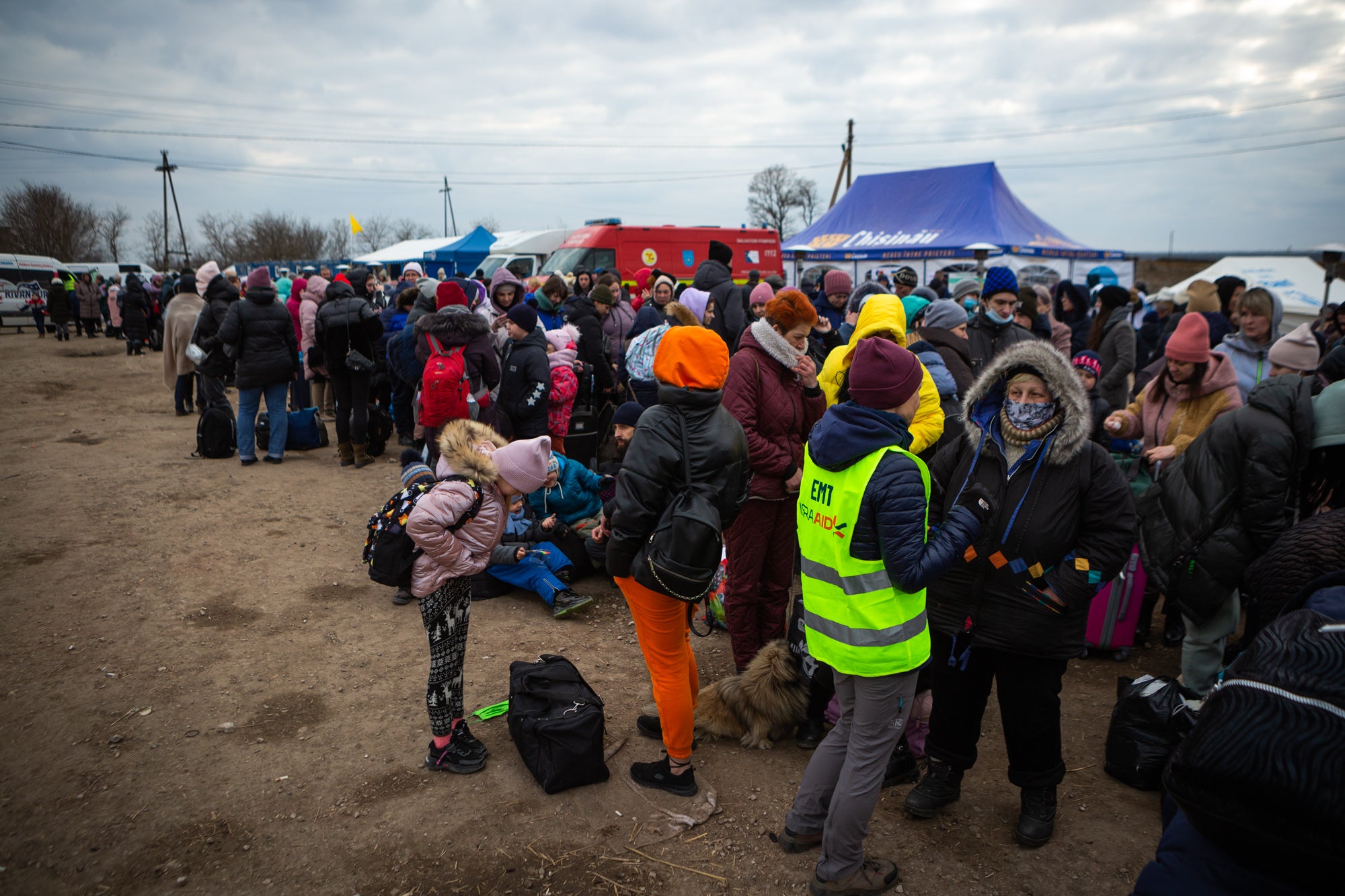 ‘Many waited anxiously for news of relatives, friends, or distant acquaintances, still in line on the other side. Many held their children – or their pets – under blankets, shivering, trying to get warm’
