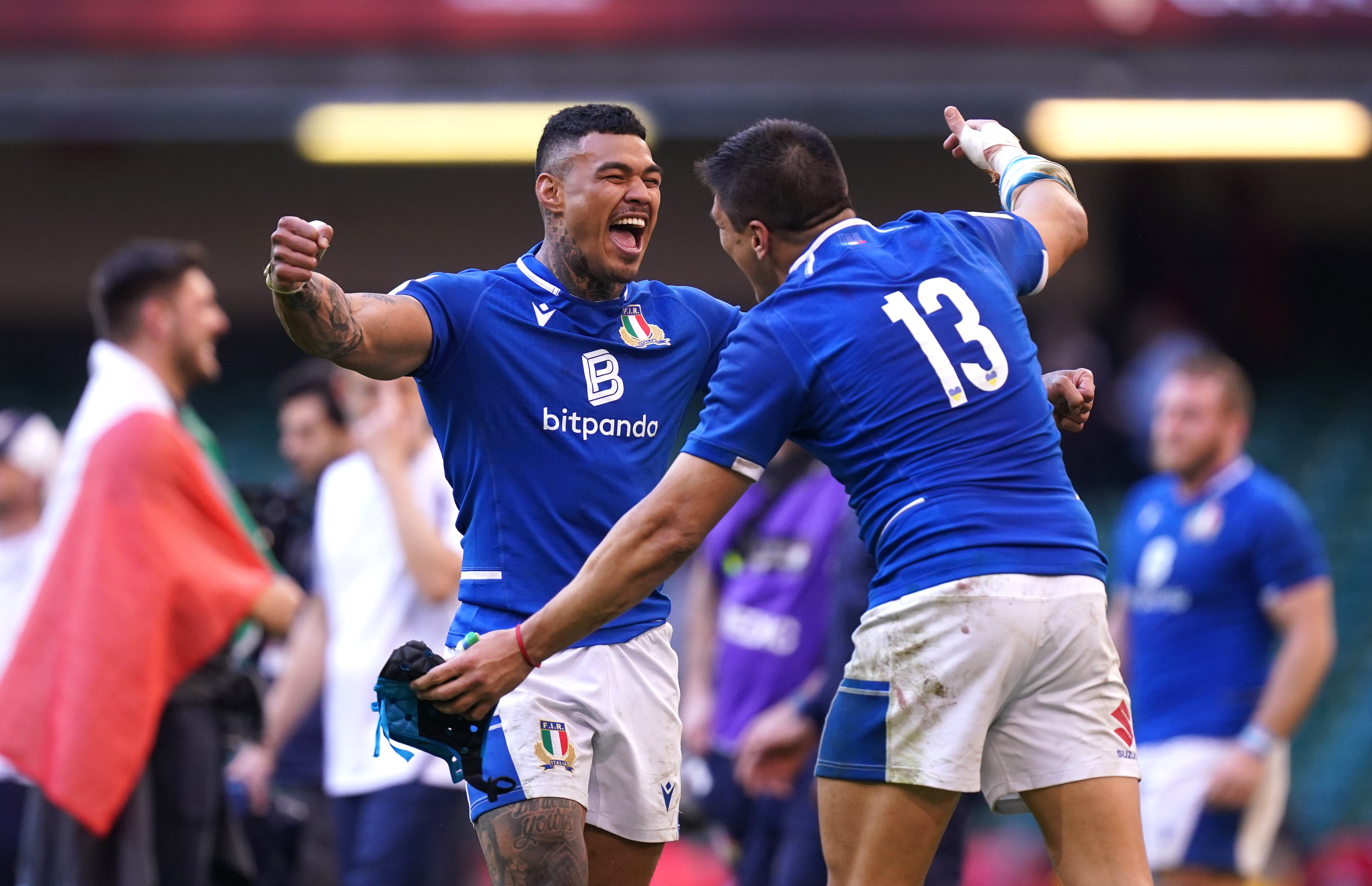 Italy players Monty Ioane, left, and Ignacio Brex Juan celebrate their Six Nations victory over Cardiff (Mike Egerton/PA)