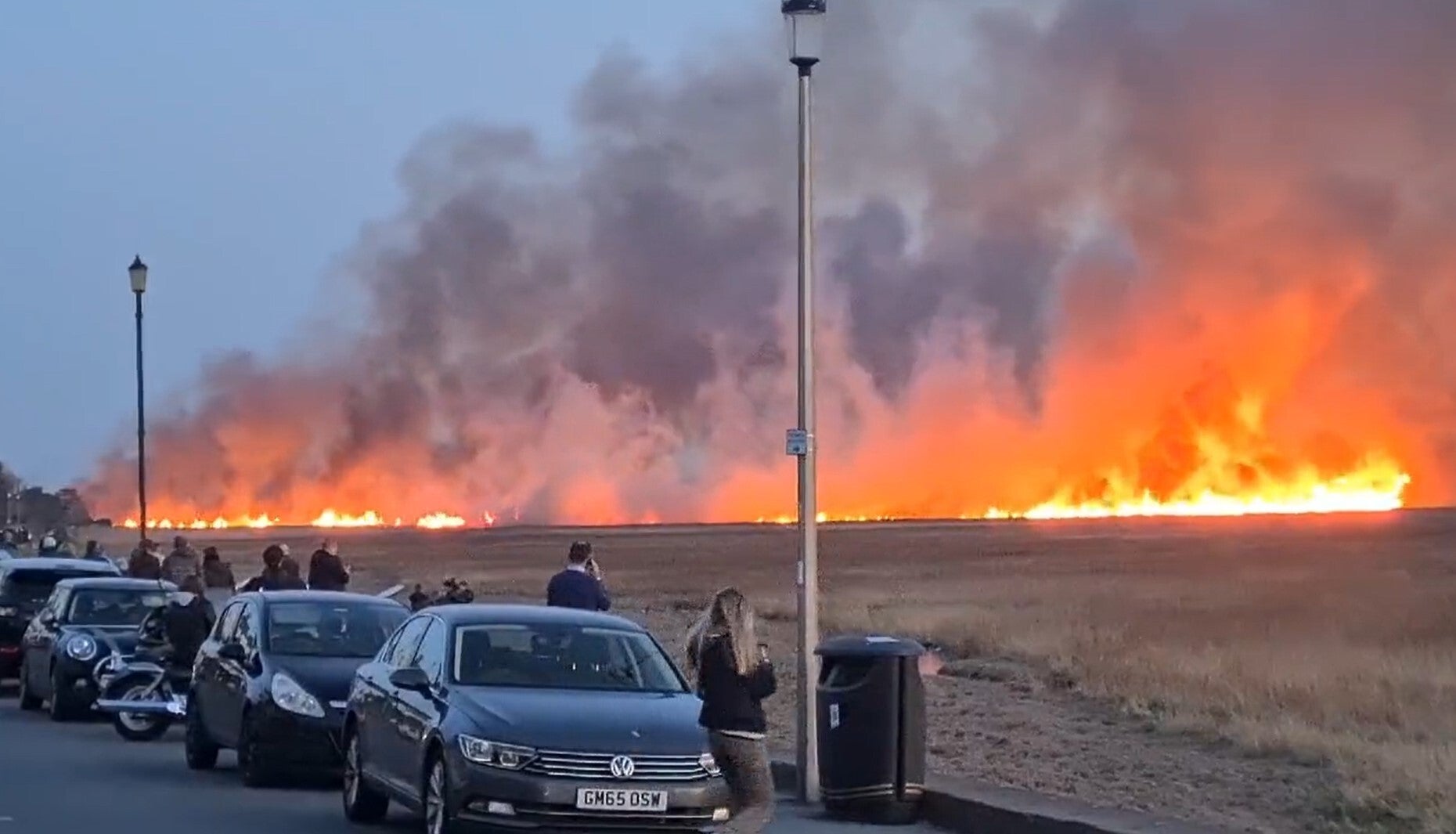 A suspected deliberately started blaze on marshland on the Wirral (@ilovetolift13/PA)