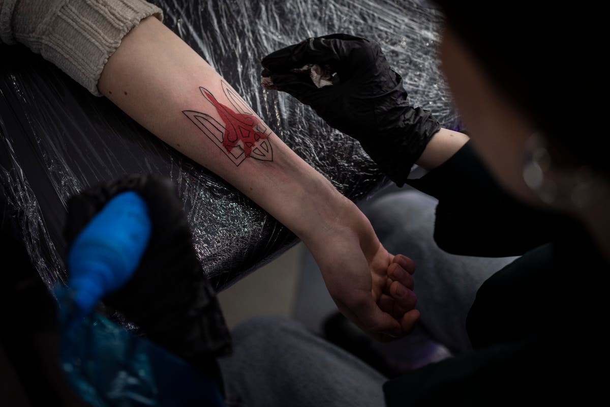 Patriotic tattoos, billboards become popular in Ukraine