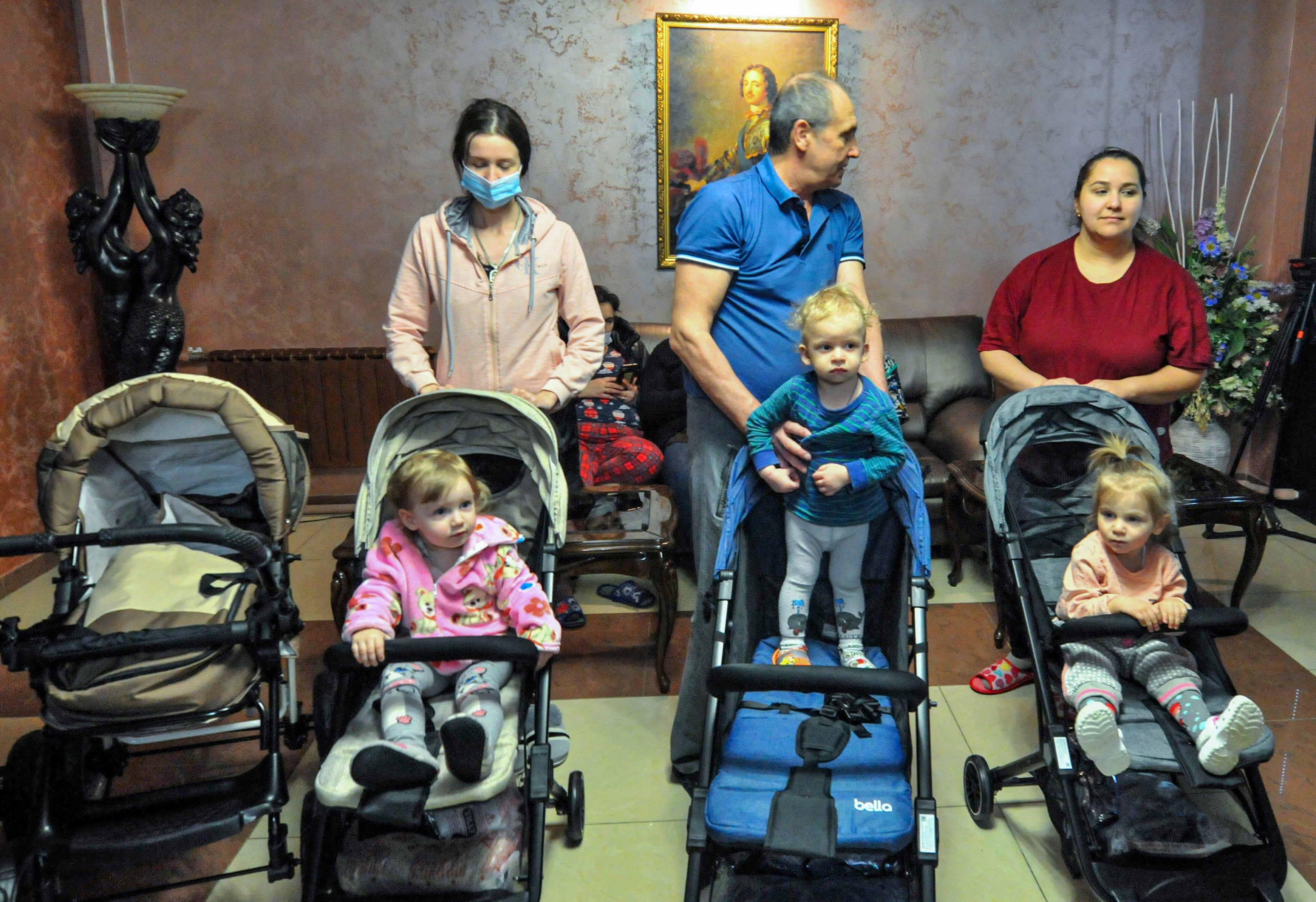 People from Mariupol play with their children in the temporary accommodation center for refugees in the Rostov region, Russia.