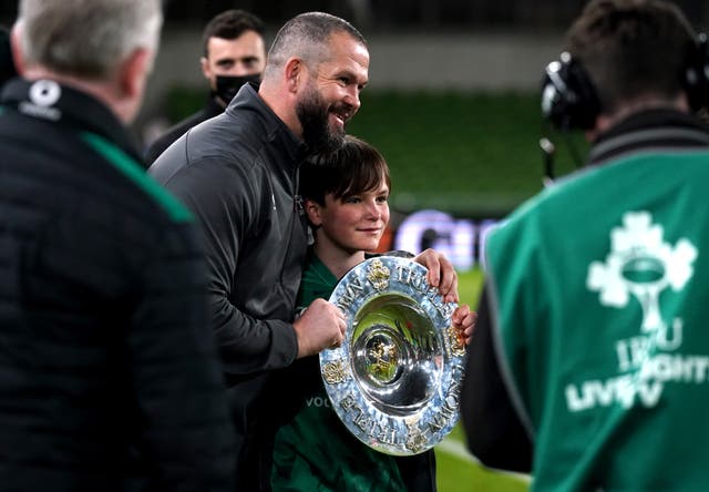 Ireland head coach Andy Farrell got his hands on the Triple Crown, alongside son Gabriel (Brian Lawless/PA)