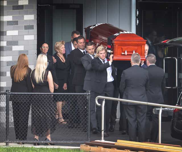 <p>Shane Warne’s coffin is carried out following the funeral</p>