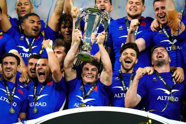 France captain Antoine Dupont holds aloft the Guinness Six Nations trophy (Adam Davy/PA)