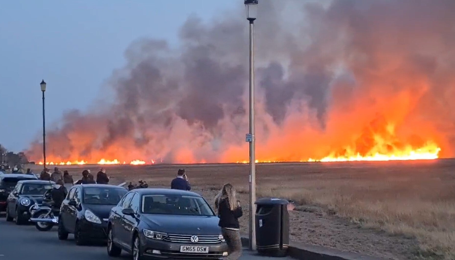 Picture taken with permission from the twitter feed of @ilovetolift13 of a suspected deliberately started blaze on marshland on the Wirral