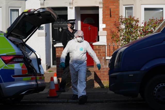 Forensic officers at the scene in Moore Street, Kingsley, Northampton (Jacob King/PA)