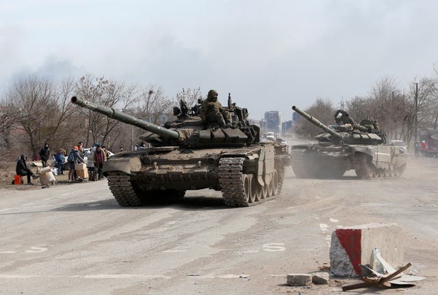 <p>Pro-Russian troops on tanks on the outskirts of Mariupol on Sunday</p>