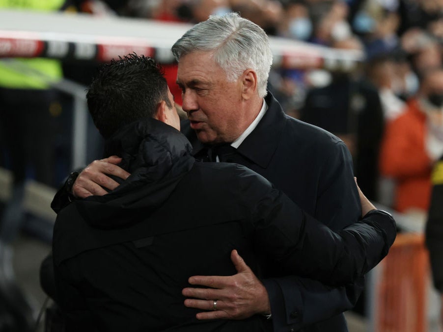 Ancelotti and Xavi embrace after Sunday’s El Clasico