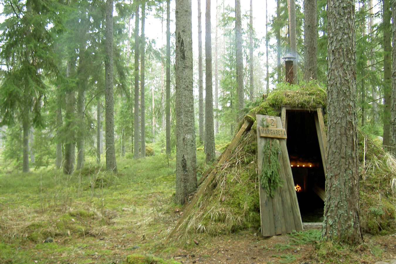 Huts built into the earth at ‘Sweden’s most primitive hotel’, Kolarbyn