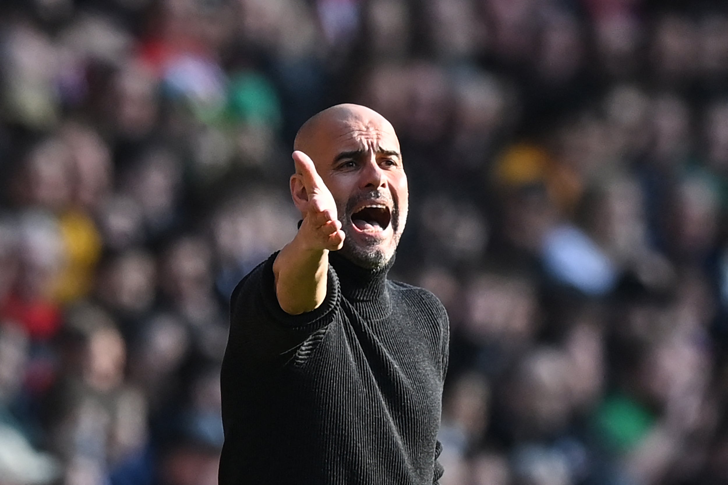 Pep Guardiola signals from the touchline