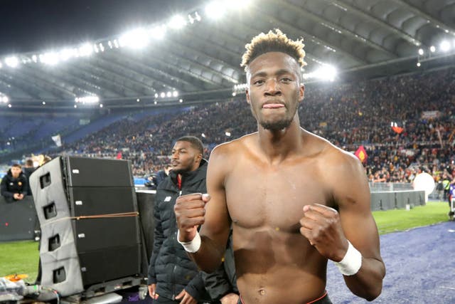 <p>Tammy Abraham celebrates after scoring twice in the Rome derby</p>
