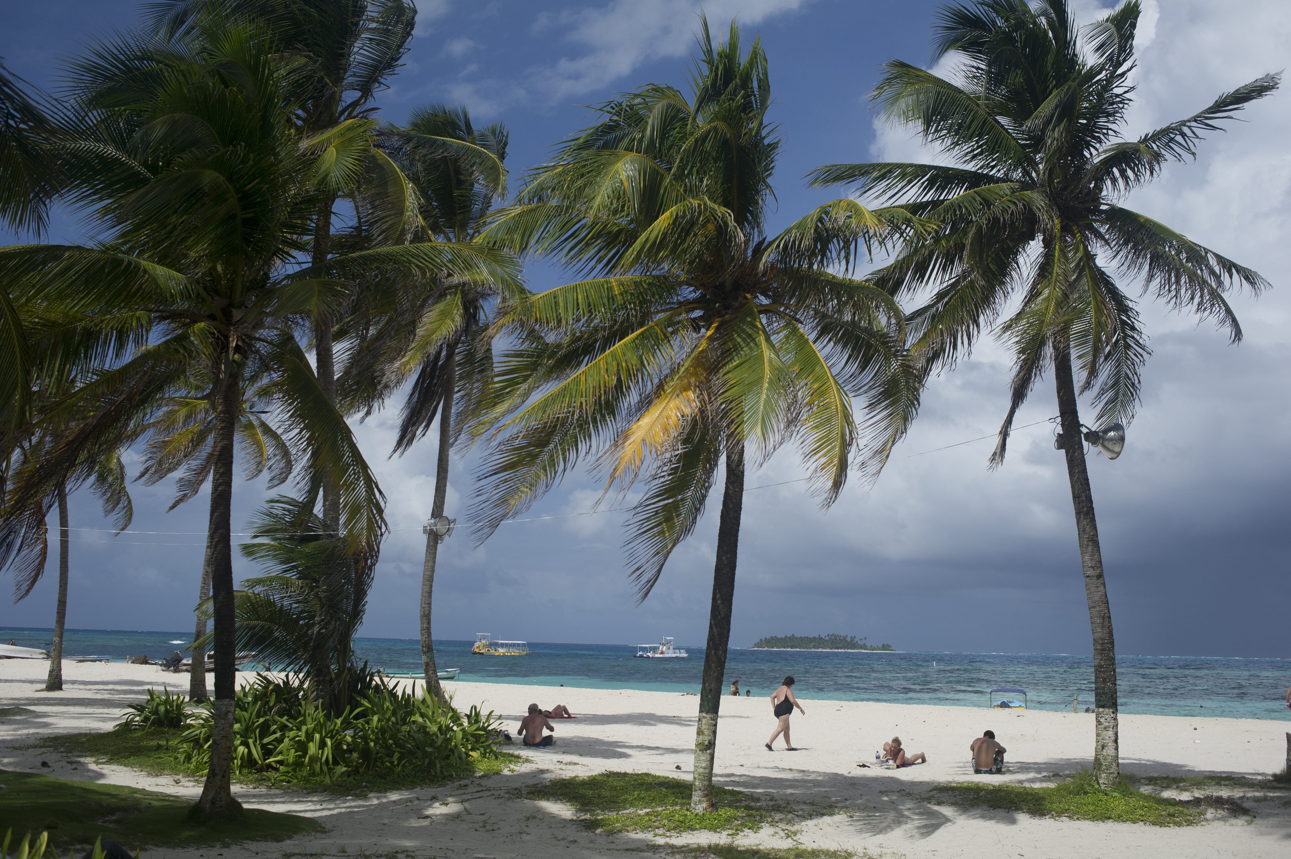 Tourists enjoy the beach in San Andres Island, Colombia, on November 30, 2012