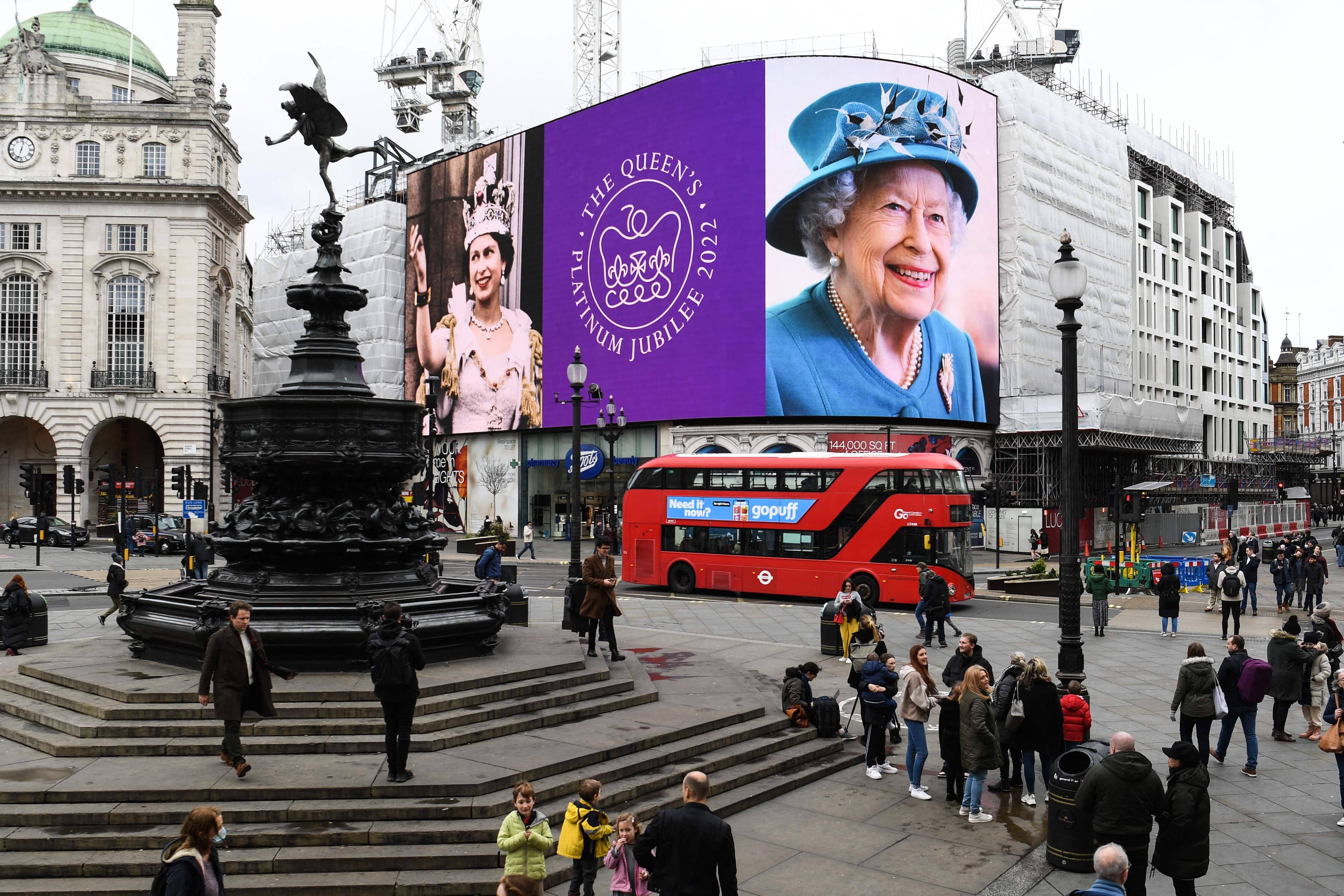 Images of Queen Elizabeth II are displayed in Piccadilly Circus, London, on 6 February 2022 to mark the start of her platinum jubilee year.