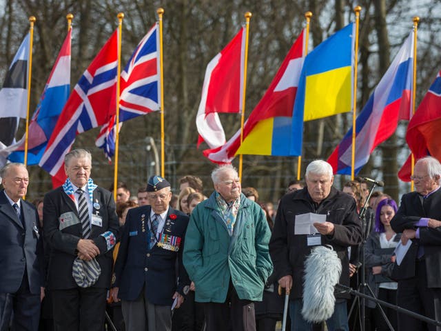 <p>Holocaust survivor Boris Romanchenko (second right), 96, has died after a Russian rocket hit his home in Kharkiv, Ukraine</p>