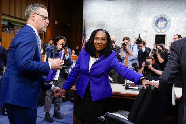 <p>Supreme Court nominee Ketanji Brown Jackson departs with her husband Dr. Patrick Jackson (L) after the first day of her Senate Judiciary Committee confirmation hearing on Capitol Hill</p>