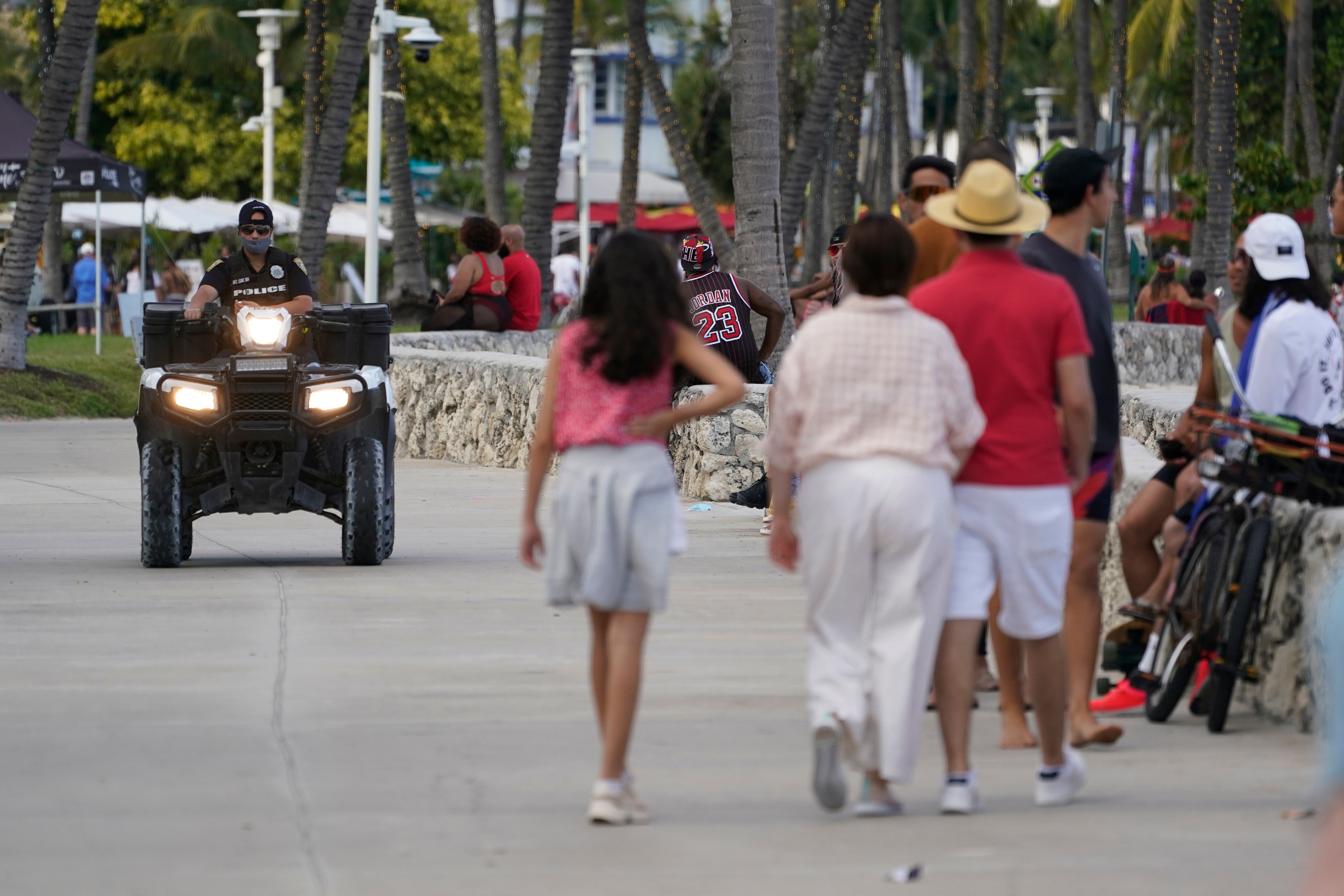 A police officer on an ATV patrols in Miami Beach, Florida’s famed South Beach