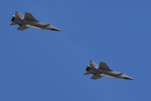 <p>Russia's MiG-31 supersonic interceptor jets carrying hypersonic Kinzhal (Dagger) missiles fly over Red Square during the Victory Day military parade in Moscow on May 9, 2018. </p>