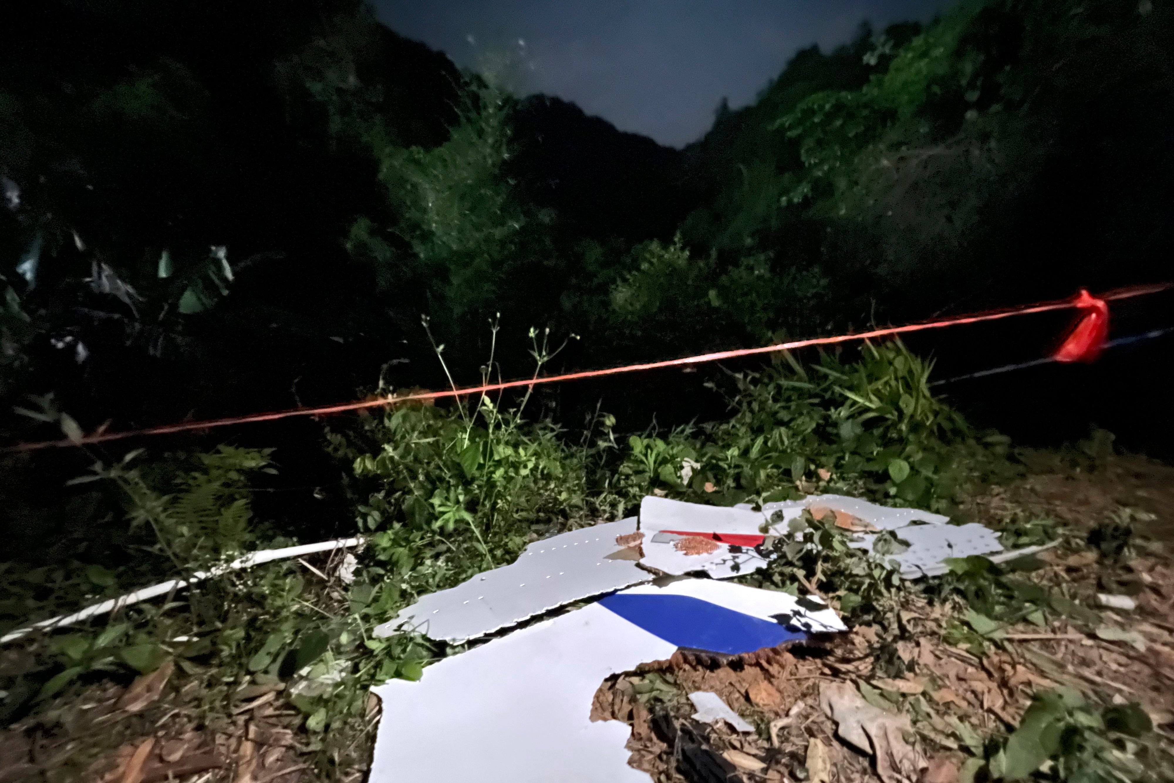 Debris is seen at the site of the plane crash in Tengxian County in southern China's Guangxi region