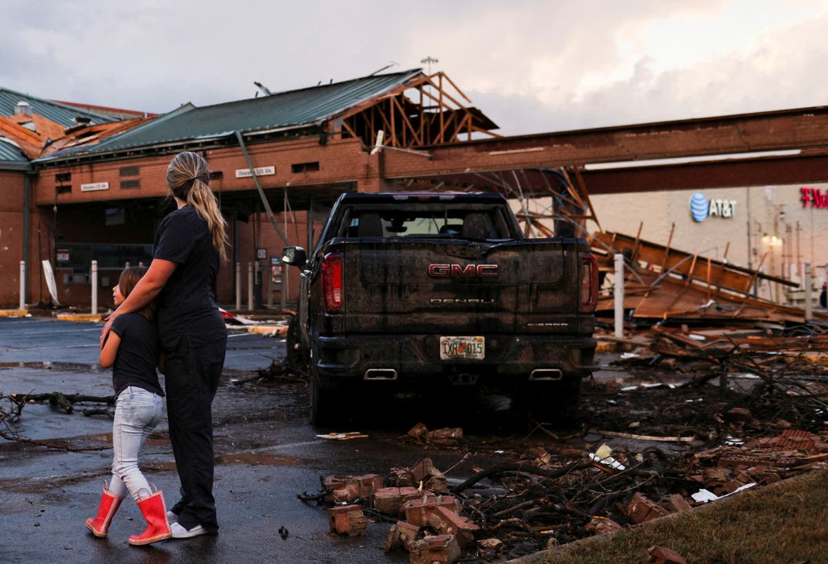 Texas tornado warning - live: Video shows Walmart shoppers being dragged as South now faces flooding