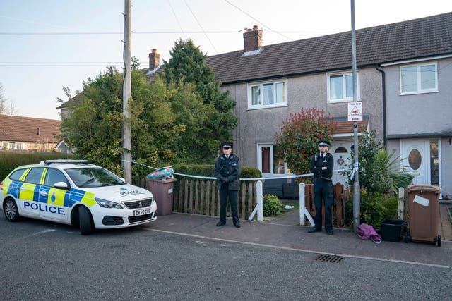 <p>Police outside a house in St Helens after a 17-month-old girl died after being attacked by a dog</p>