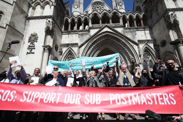 Former subpostmasters outside the Royal Courts of Justice after their court win (Yui Mok/PA)